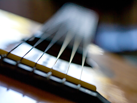 Acoustic guitar. Bridge, Saddle, Strings, Sound hole and neck (frets, fretboard, tuners, headstock,...