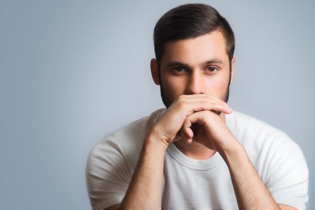 Casual young man studio portrait