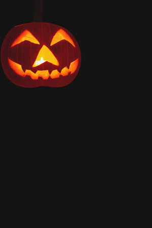Halloween pumpkin on black background with copy space for text or designの写真素材