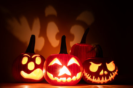 Halloween pumpkins with scary faces on dark backgroundの写真素材