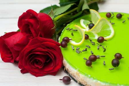 cheesecake with green jelly, berries and chocolate chipsの写真素材