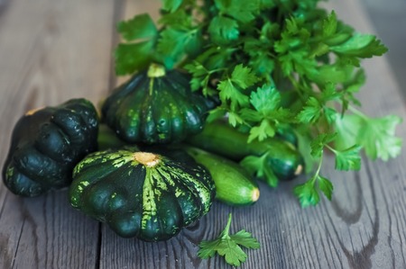 Organic yang pattypan squashon the wooden tableの写真素材