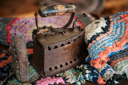 Two antique old cordless iron on wood wallの写真素材