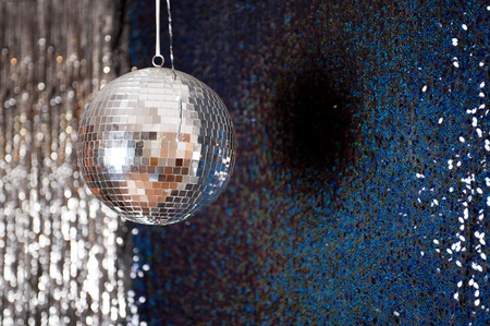 Mirror disco ball hanging from the ceiling.の写真素材