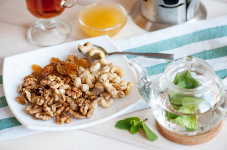 Healthy breakfast: nuts mix and mint tea.の写真素材