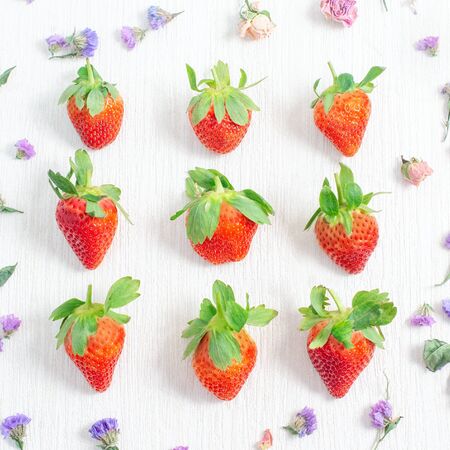 Strawberry on white background. Strawberry pattern. Flat lay, top viewの写真素材