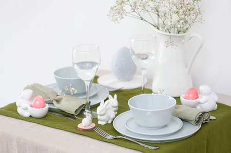 Beautiful Easter table setting with blue plate