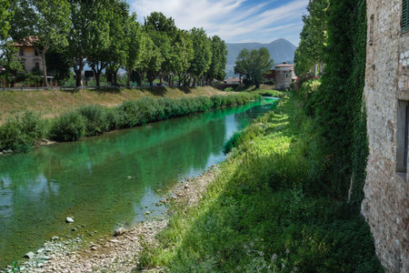 topino river flowing along the walls of foligno umbriaの写真素材