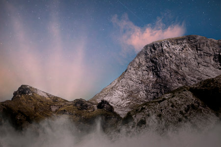 sunrise behind one of the peaks of the Apuan Alps in Tuscanyの写真素材