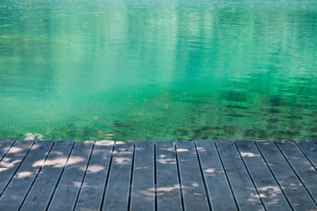 horizontal wooden pier or on the shore of the lake of sinizzo in abruzzoの写真素材