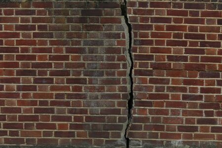 Wall bricks with a crack, background images.の写真素材