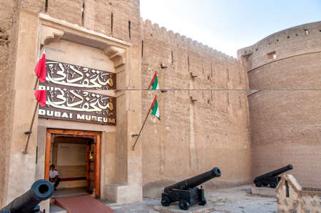 Dubai museum and minaret entrance Al Fahidi fort with cannons (oldest building in Dubai), Middle East, United Arab Emirates, Dubaiのeditorial素材