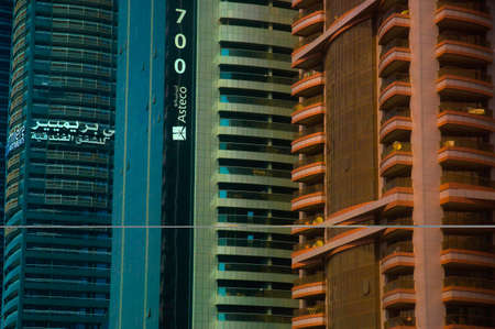 Colorful architecture on the skyscrapers. Asteco properties corporate in Dubai