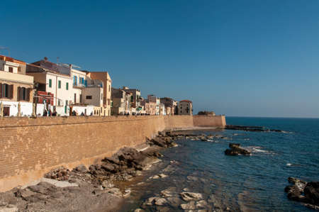 Waterfront with Mediterranean sea in the coastal town of Alghero during the sunset, Sardinia, Italyのeditorial素材