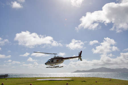 Helicopter landing on a tropical island