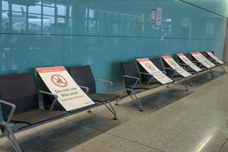 Heathrow International Airport, London, UK - May 8 2021: No passenger on waiting chairs at the...