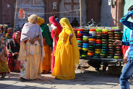 Jodhpur, Rajasthan, India - January 11, 2017: Women dressed in colourful clothes in the street marketのeditorial素材