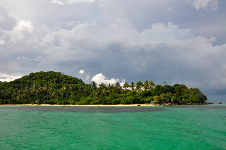 Wild stunning tropical coastline with lush vegetation and turquoise water in Karimunjawa, Indonesiaの写真素材