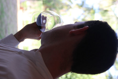 Randheli, Maldives - February 8, 2014: Wine tasting course. French sommelier preparing the wine