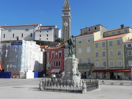 The beautiful Tartini Square in Piran with the church and the belltower on backgroundのeditorial素材