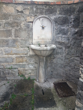 An old public fountain survives in the periphery of Triesteの写真素材