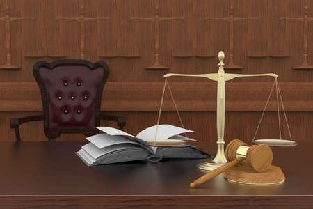 Symbols of law and justice placed on a reflective surface.の写真素材