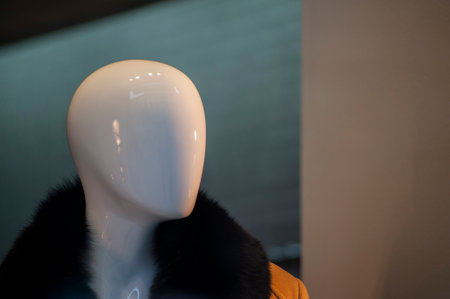 Close up face portrait of a mannequin in a fashion shop window.の写真素材
