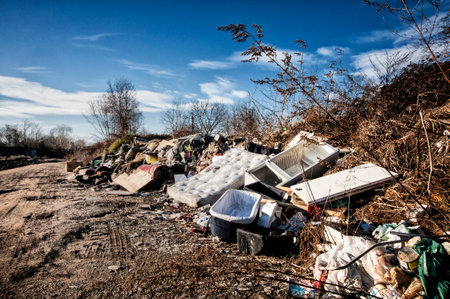 On the outskirts of the city rubbish and rubbish abandoned on the edge of a road.の写真素材