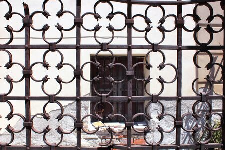 evocative image of texture of old wrought iron gateの写真素材