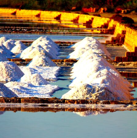 heaps of salt near the salt flats at sunsetの写真素材