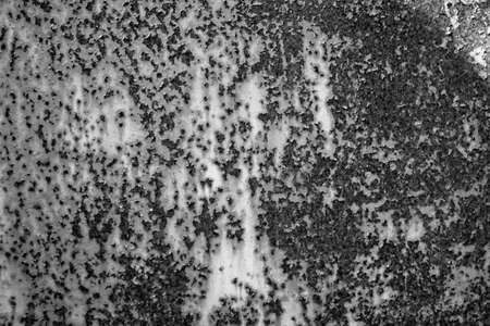 evocative black and white image of texture of rusty steel plateの写真素材