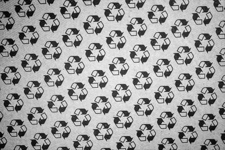 evocative black and white texture image of recyclable logoの写真素材