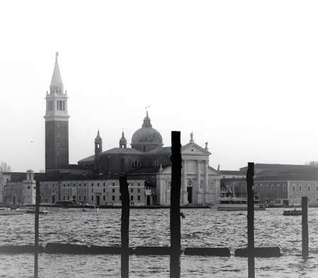 Venice, Italy, December 28, 2018 evocative black and white image of a gondola moored with San Giorgio island in the backgroundのeditorial素材