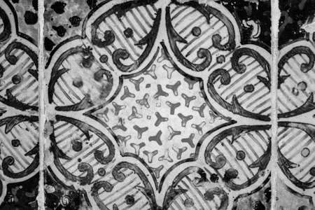 evocative black and white image of old vintage colored floor tile
