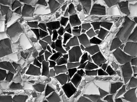 evocative black and white image of irregular brick texture with the design of a six-pointed star in the centerの写真素材