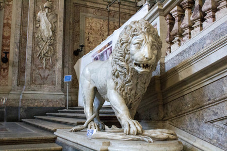 Royal Palace of Caserta, Italy, June 27, 2020, historical royal palace commissioned by Charles of Bourbon king of Naples, lion statue on the main stairsのeditorial素材