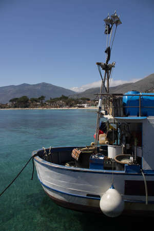 evocative image of fishing boats moored in the harbor in a small fishing village in Sicily, Italyの写真素材