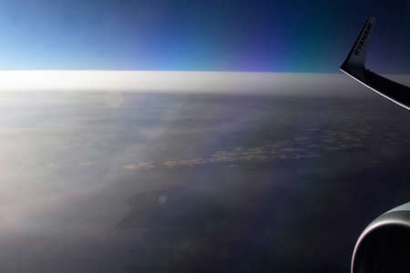 2020.12.27 Milan Malpensa Airport, Ryanair low cost airline in flight to Italy, wing of the plane...