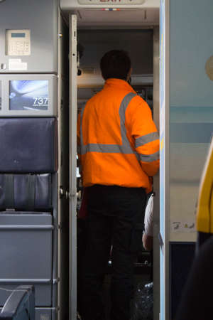 2020.12.27 Milan Malpensa Airport, Ryanair low cost airline in flight to Italy, ground technician in the cockpit before take offの写真素材
