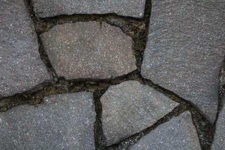 evocative image of uneven tile wall