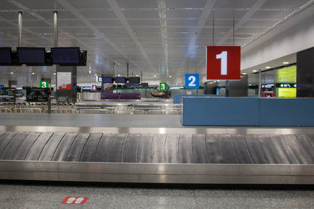 2021.11.26 Milan Malpensa Airport, evocative image of a numerical series from 4 to 1 of baggage conveyor belts in an airportのeditorial素材