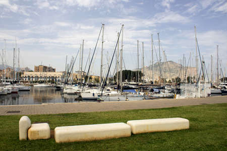 touristic port of Palermo in Italy, sailboats moored in the roadsteadの写真素材