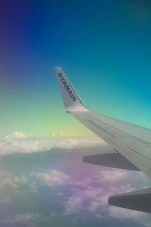 2021.09.28 Milan Malpensa Airport, Ryanair low cost airline in flight to Italy, evocative image of the wing of the plane during the flightのeditorial素材