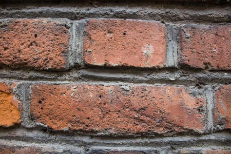 evocative image of old orange bricks of an external perimeter wall