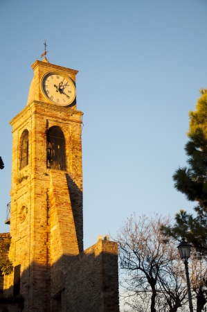 old bell tower with clock fiorenzuola village of focare pesaro Italyの写真素材