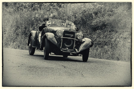 Pesaro, Italy - May 15, 2015: CA FIAT 514 Sport Spider 1931 nidentified crew on an old racing car in...