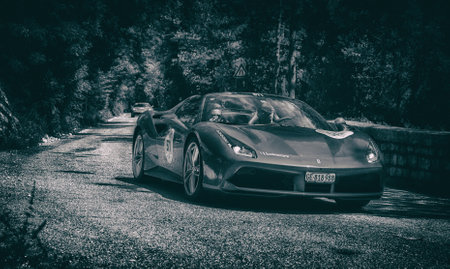 GOLA DEL FURLO, ITALY - FERRARI 488 SPIDER 2015 on an old racing car in rally Mille Miglia 2017 the...