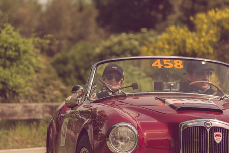 PESARO COLLE SAN BARTOLO, ITALY - MAY 17 - 2018: LANCIA AURELIA B24 CONVERTIBLE 1957 old racing car in rally Mille Miglia 2018 the famous italian historical race (1927-1957)のeditorial素材