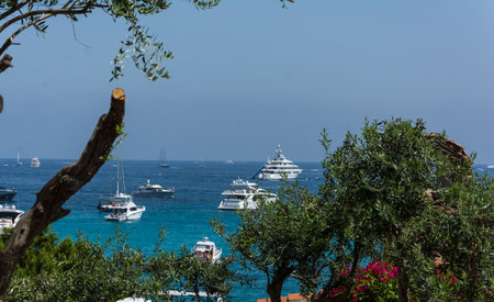 Porto Cervo sardinia, august13, 2019: Panoramic view of small pevero beach with yacht