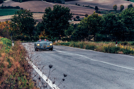 CAGLI, ITALY - OCT 24 - 2020: JAGUAR C-TYPE 1952 on an old racing car in rally Mille Miglia 2020 the famous italian historical race (1927-1957のeditorial素材